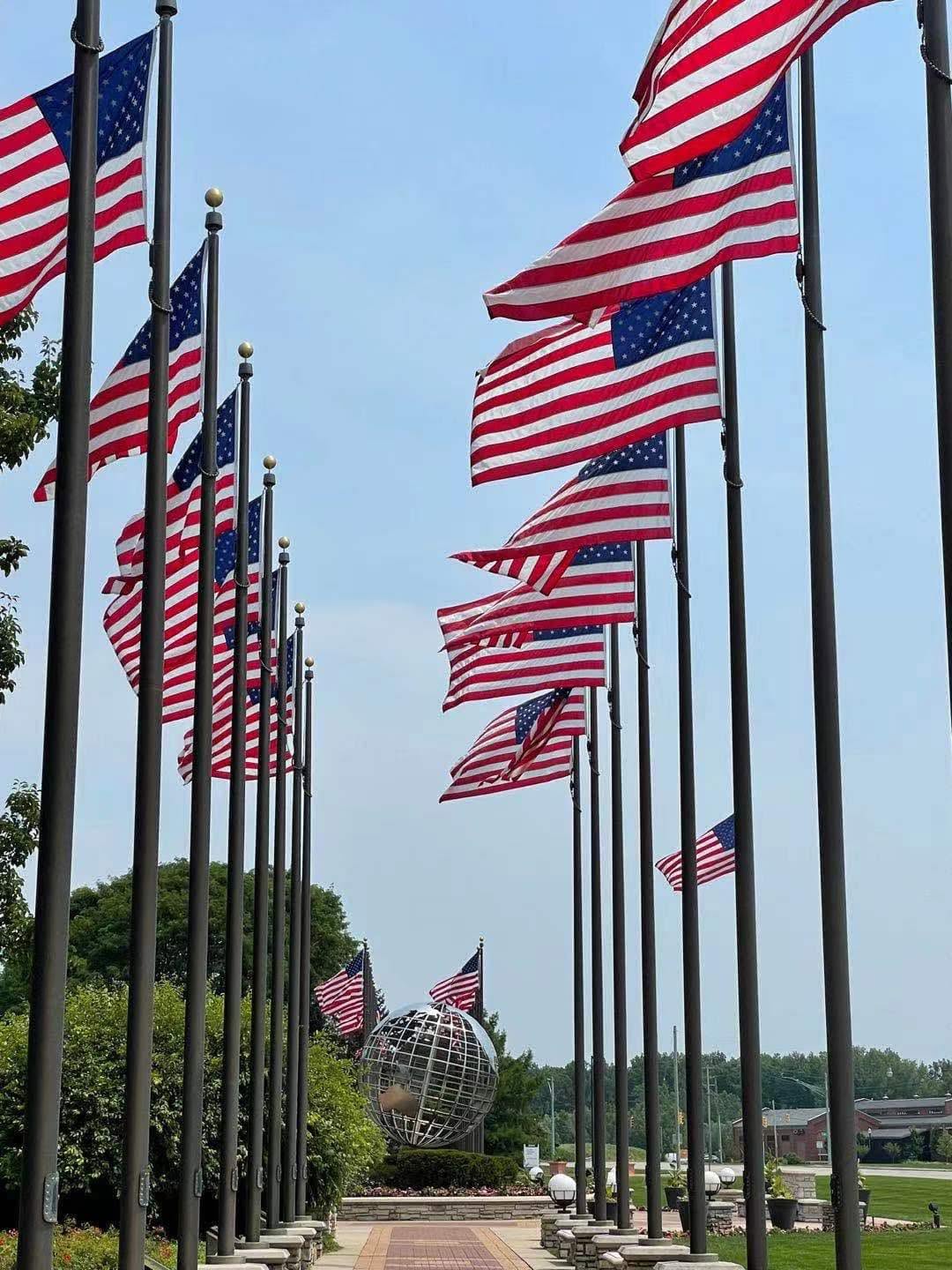 American flags lining a sunny public walkway