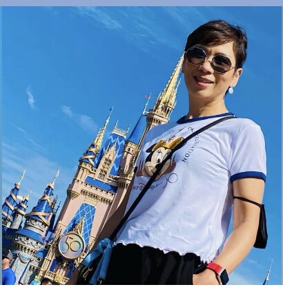 Hui-Fen smiling outdoors